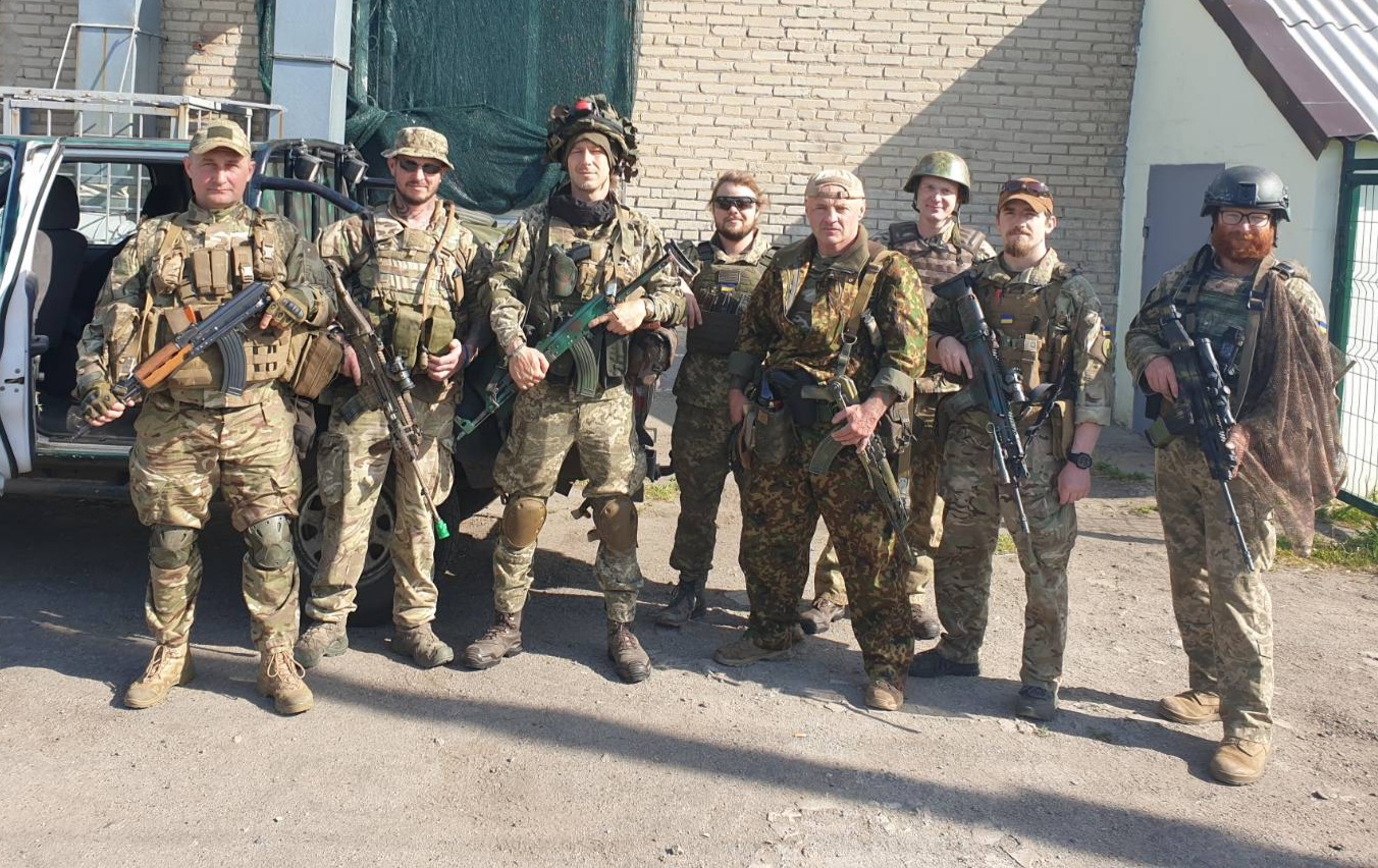 Tristan Nettles standing with fellow International Legion volunteers before a mission in Ukraine